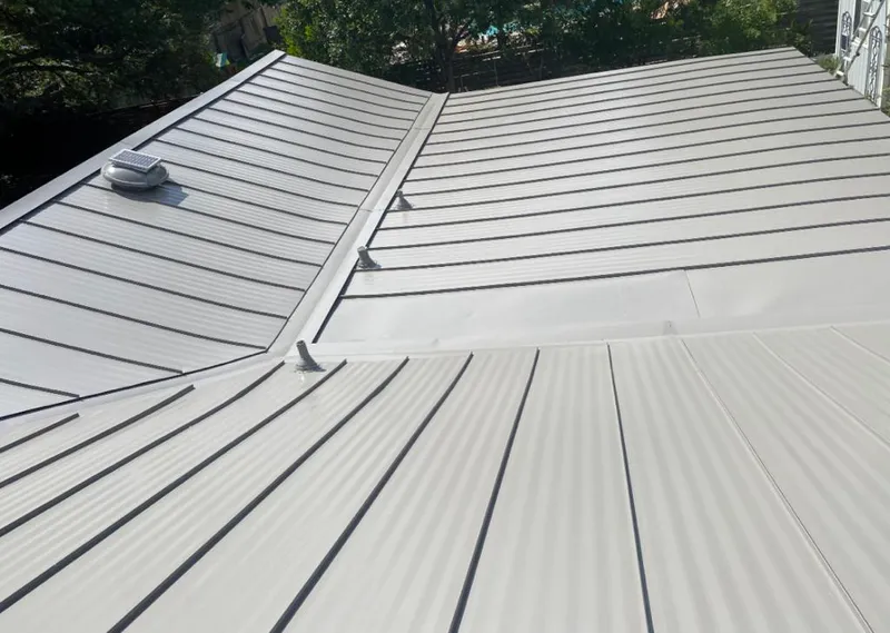 Solar attic fan installed on a metal roof for Roof Ventilation in Downers Grove